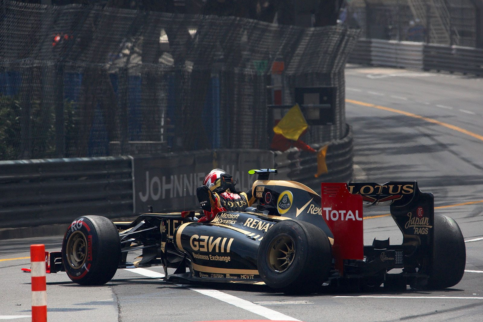 After a collision at the start with Schumacher, Romain Grosjean's Lotus retires in turn one