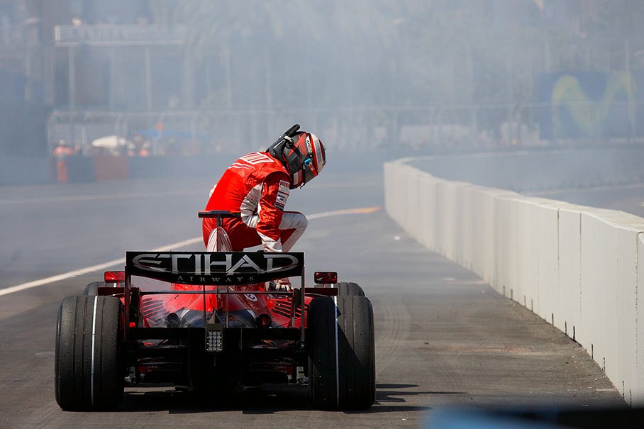 Kimi Raikkonen leaves the retired Ferrari