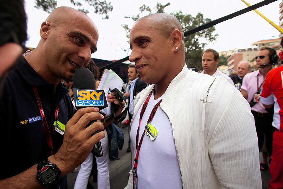 Soccer player Roberto Carlos being interviewed on the grid
