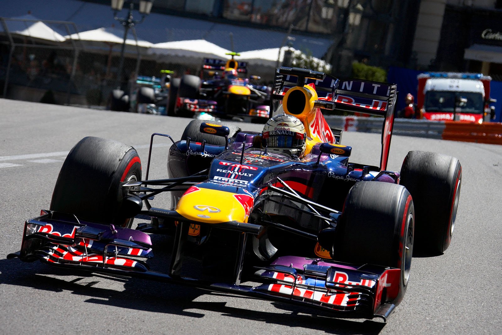 At second position is Sebastian Vettel, Red Bull Racing, and chases the race leader in front of team mate Webber and Mercedes' Hamilton