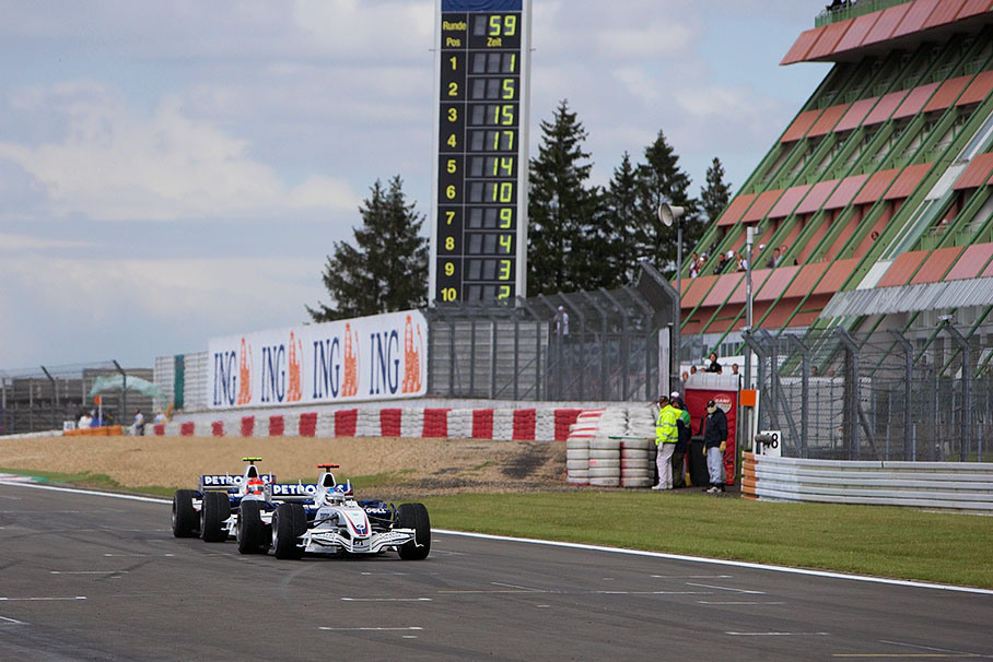 Nick Heidfeld with BMW Sauber team mate Kubica in his neck