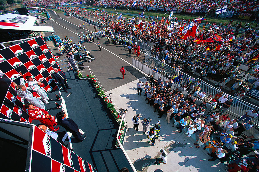 Mika Hakkinen, winner of the Hungarian Grand Prix 2000, 2nd Michael Schumacher, 3rd Hakkinen's McLaren-Mercedes team-mate David Coulthard