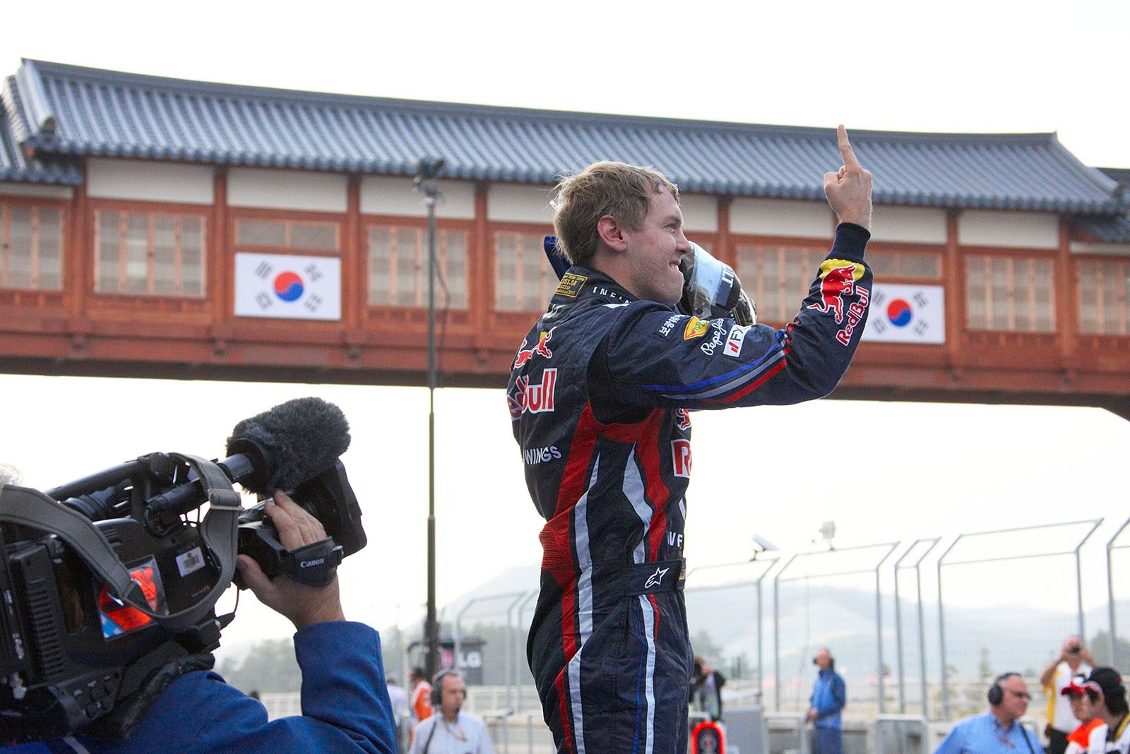 Sebastian Vettel, Red Bull Racing, celebrates on his car in parc ferme after winning the Korean GP