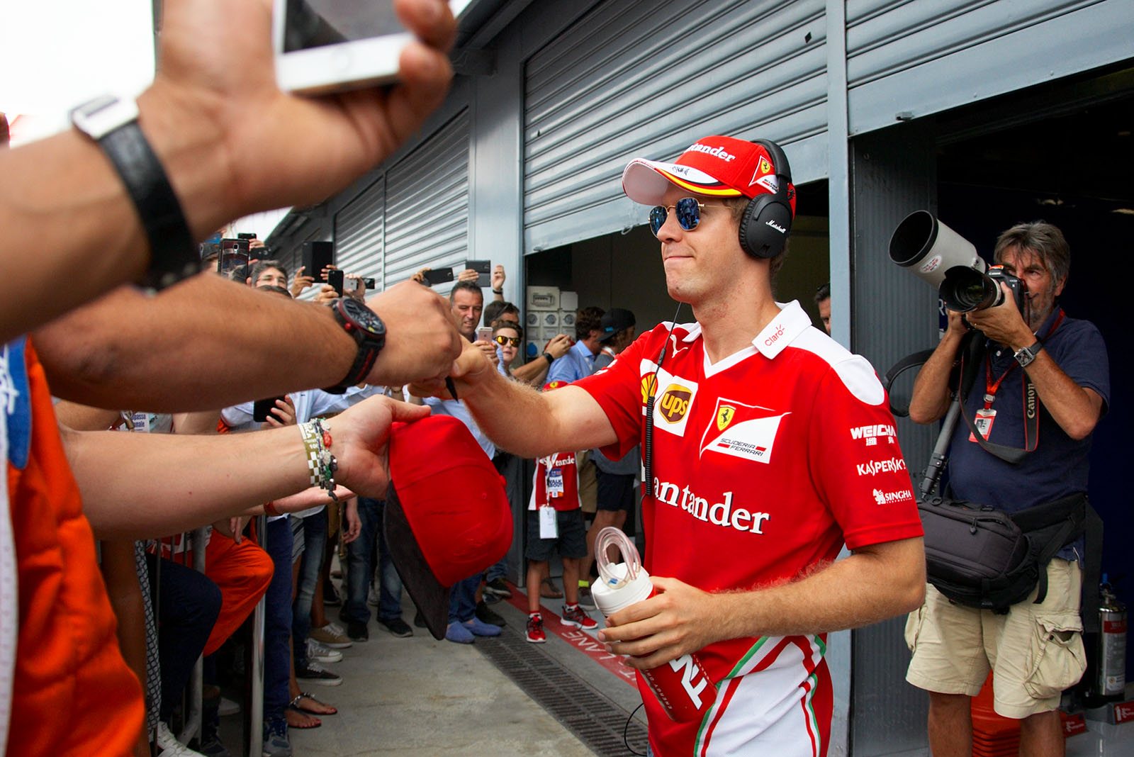 Call for autographs: Ferrai fans and their driver Sebastian Vettel, Monza, Italian Grand Prix, 2016