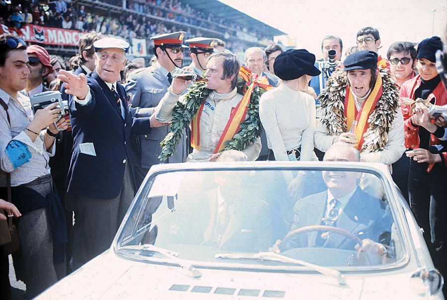 Winner of the 1971 Spanish GP Jackie Stewart on the way to his honoury lap after the race together with his wife Helen and third placed Chris Amon