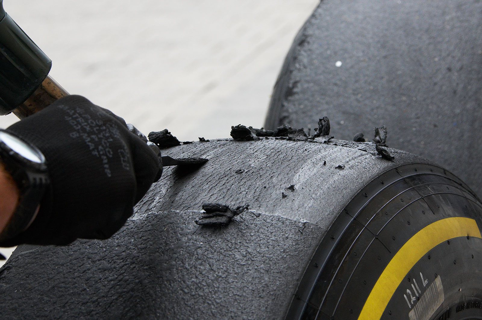 The slick tyre is used again after a thin layer of the surface is removed