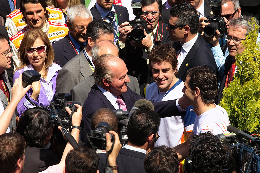 Juan Carlos, King of Spain, caresses 'his' Spanish drivers Pedro de la Rosa and Fernando Alonso, GP2 driver Javier Villa waits politely in the background (upper left hand)