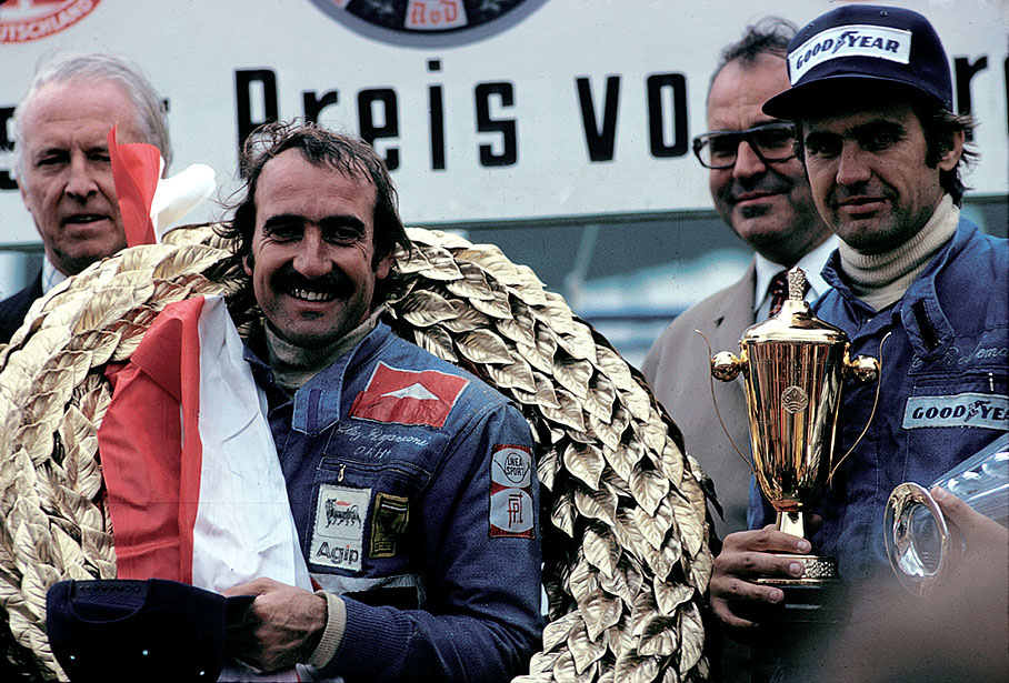 Clay Regazzoni celebrates his win on the podium after the German GP Nuerburgring 1974, together with third placed Carlos Reutemann, Dr. Helmut Kohl and the Duke of Metternich