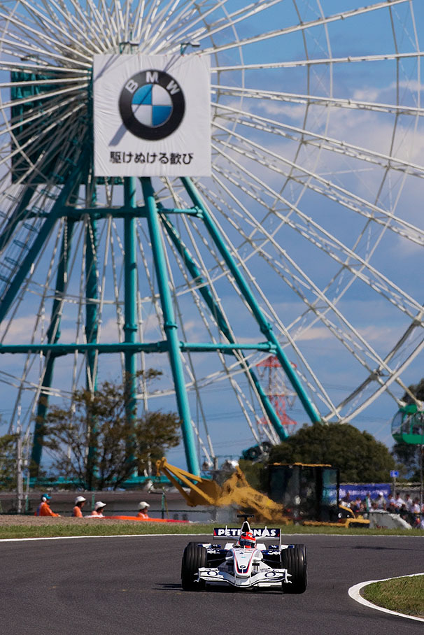 BMW Sauber driver Robert Kubica in front of the famous Suzaka landmark, the theme park's giant wheel