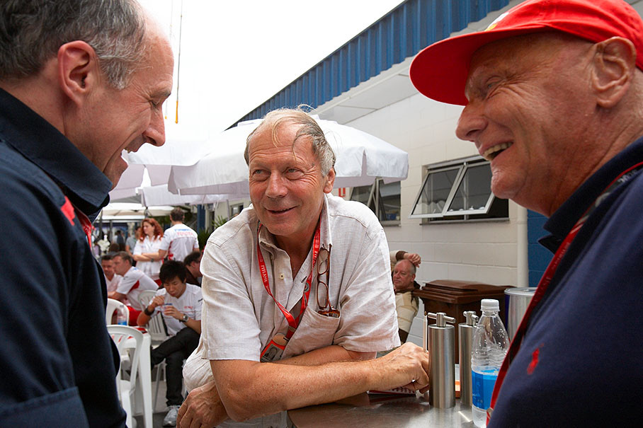 Legendary Austrian journalist Heinz Prueller chats with fellow countrymen Franz Tost of Toro Rosso and triple World Champion Niki Lauda