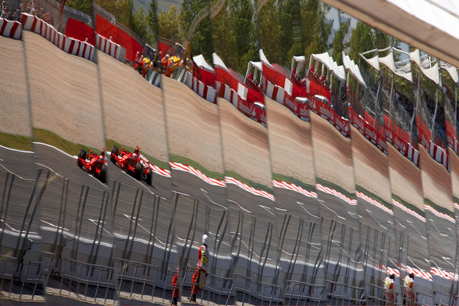 Kimi Raikkonen's Ferrari as reflection on the windows of the media center