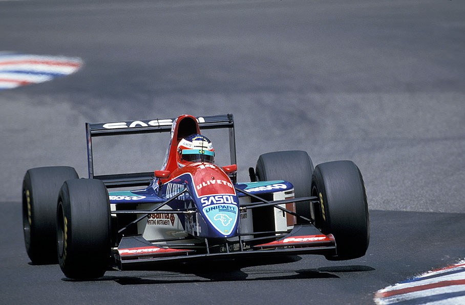Rubens Barrichello lifts a wheel of his Jordan