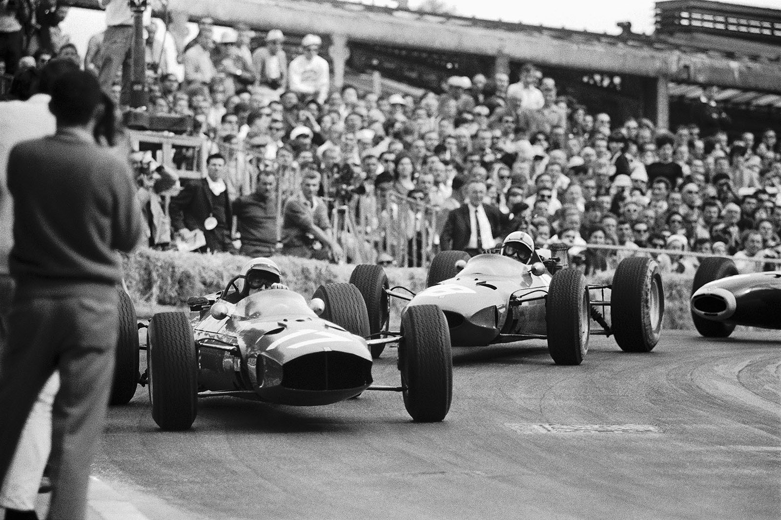 Lorenzo Bandini on Ferrari 1512 leads Surtees in the Ferrari 158, Monaco GP 1965
