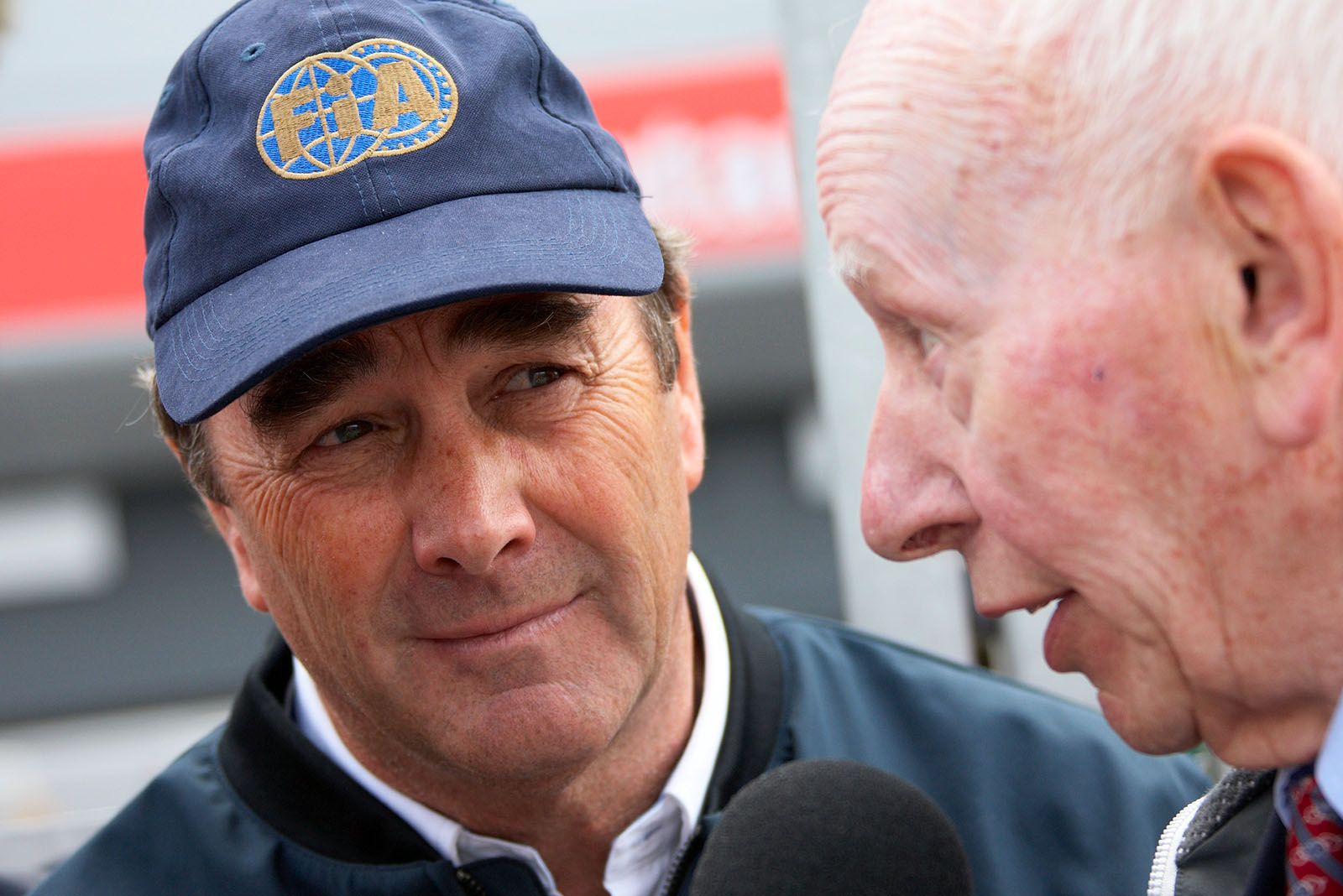 Nigel Mansell talks with John Surtees