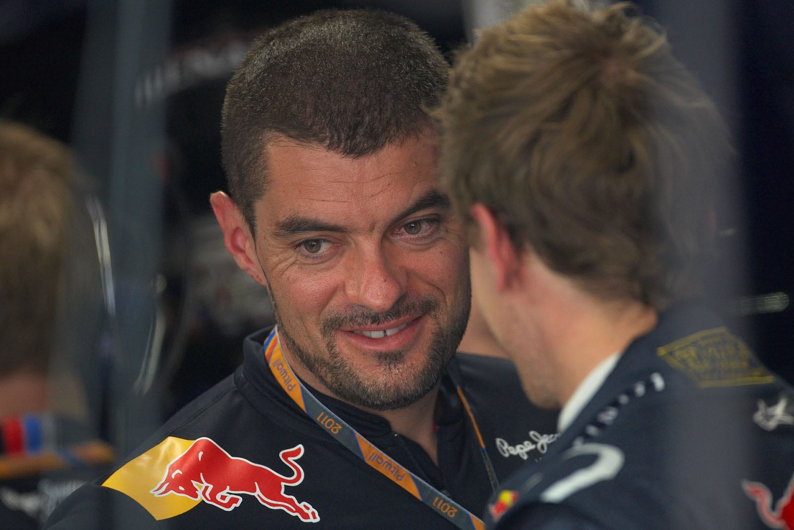 Sebastian Vettel listens to his race engineer Guillaume Rocquelin in Red Bull Racing pits