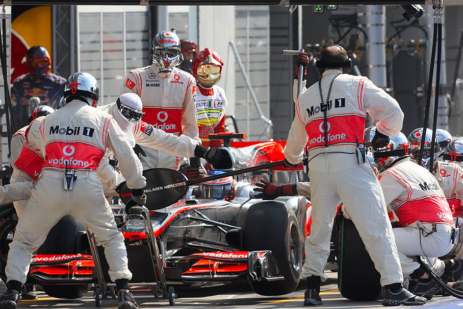 Jenson Button stops at McLaren pits