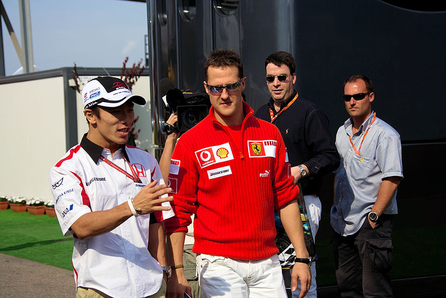 Michael Schumacher with Takuma Sato
