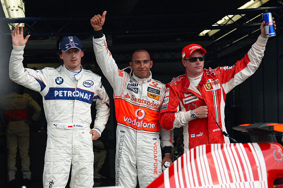 The fastest three qualifiers pose for the media after Q3: Third grid placed Kimi Raikkonen (right hand) and polesitter Lewis Hamilton of McLaren Mercedes (middle) with grid's second positioned Robert Kubica of BMW Sauber