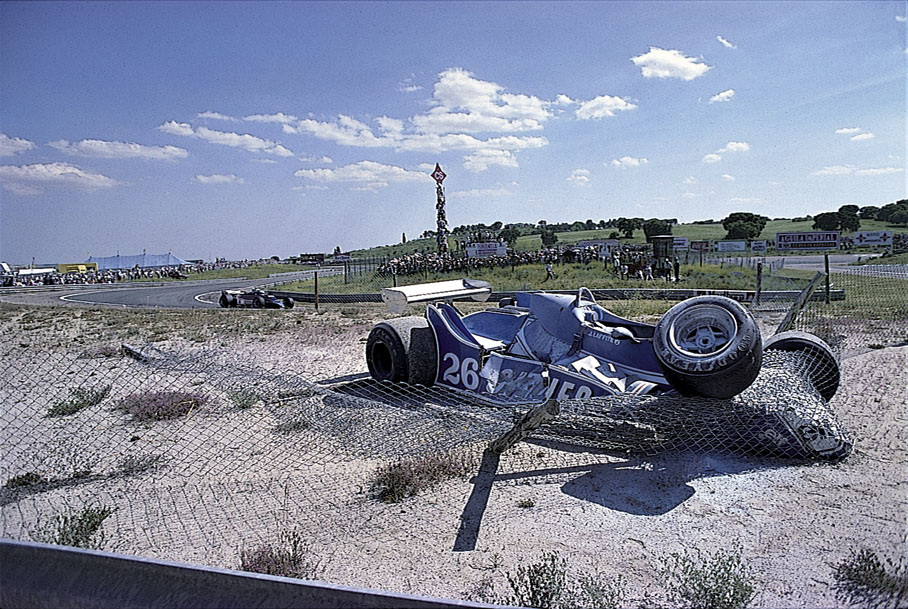 Jacques Laffite's Ligier in the fence barrier after a collision with Carlos Reuteman (Williams) while batteling for the lead.
