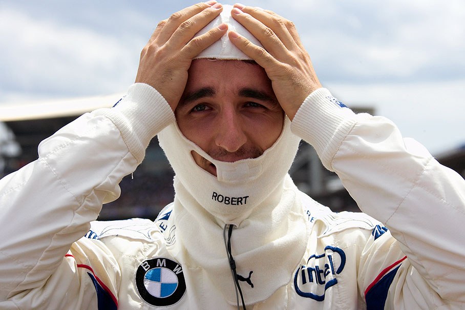 Robert Kubica puts his balaclava on