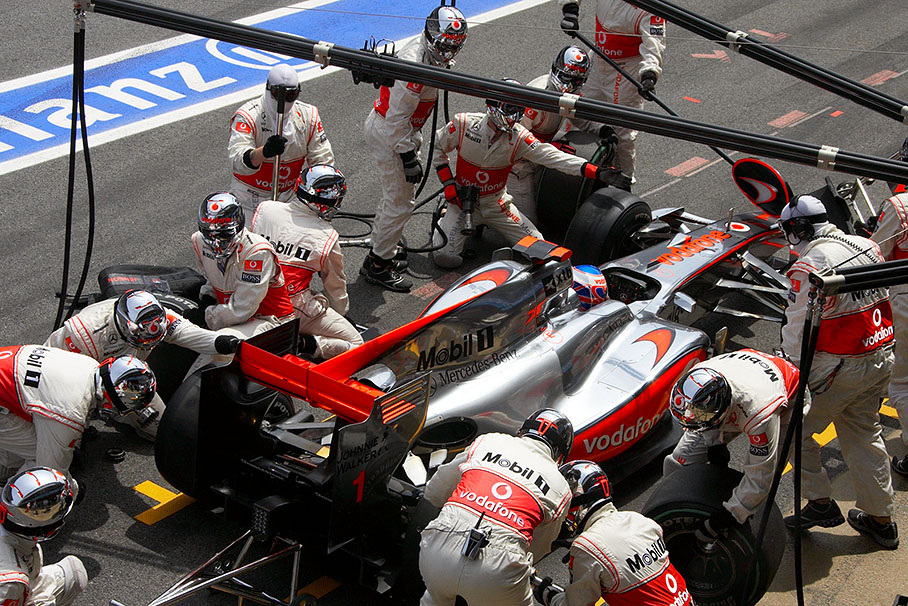 Jenson Button is being serviced at McLaren Mercedes pits