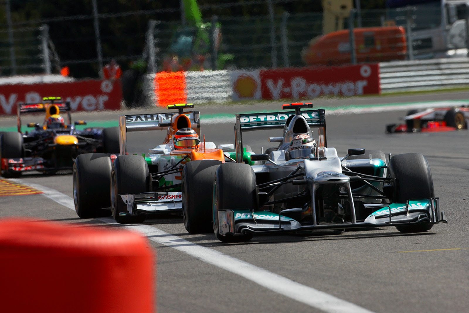Michael Schumacher, Mercedes GP, still keeps his position in front of chaser Nico Hulkenberg of Sahara Force India