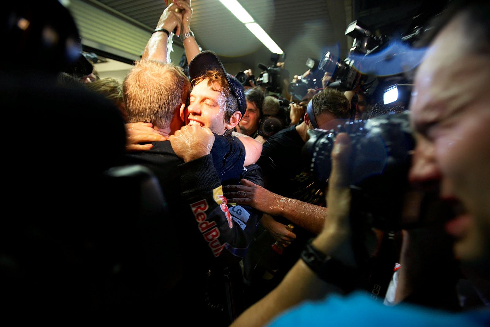 Sebastian Vettel celebrates with the Red Bull team