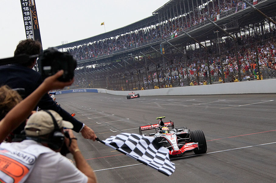 Lewis Hamilton takes the chequered flag