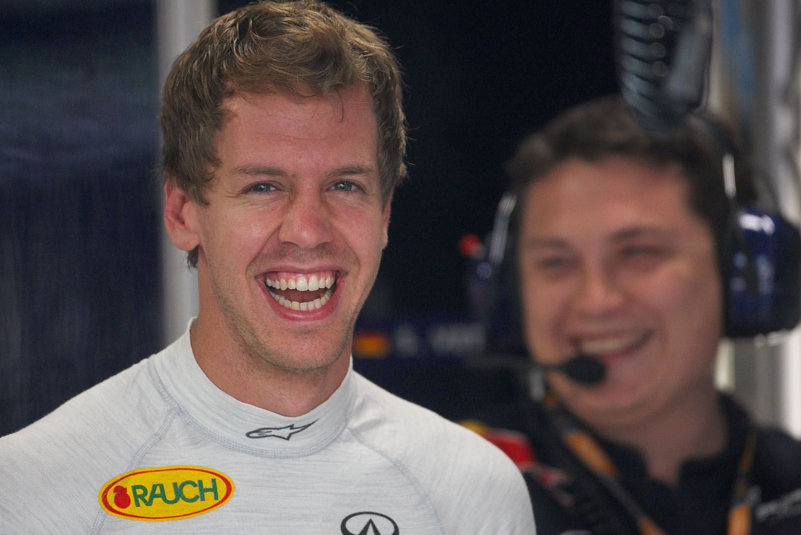 Sebastian Vettel and his mechanics burst in laughs as the song 'Who let the dogs out?' is played in the pits whilst the session is stopped because a wild dog is hunted on the race track