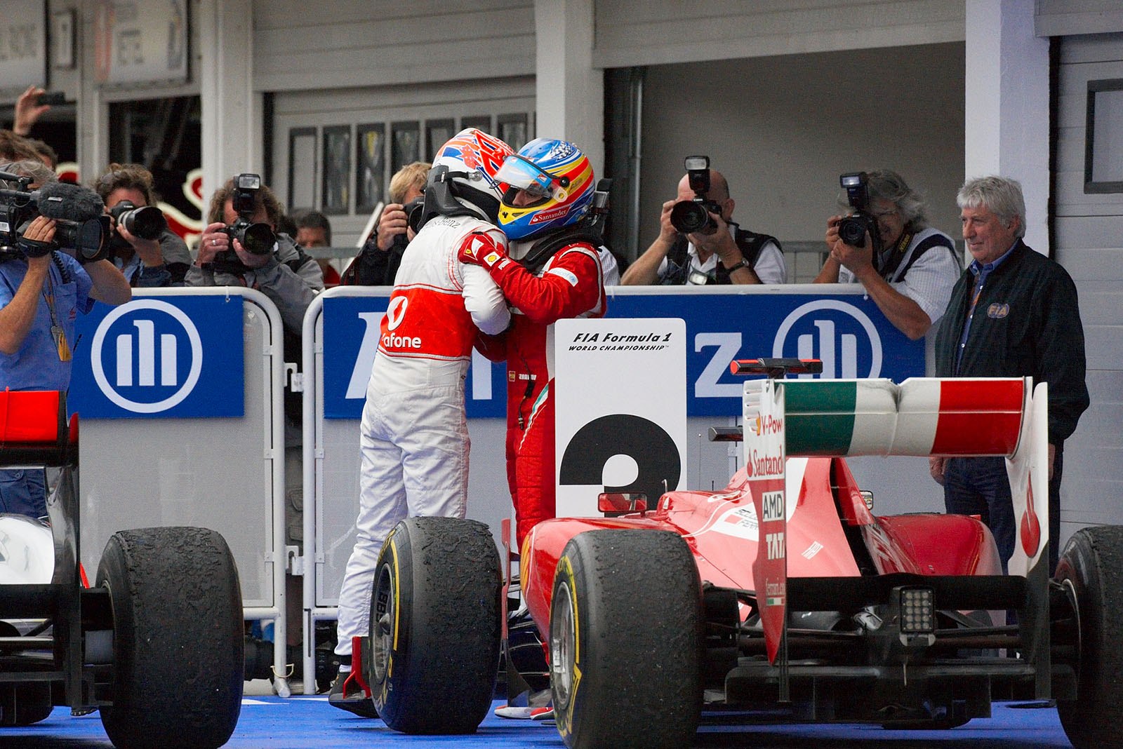 Race winner Jenson Button, McLaren Mercedes, receives congrats from third placed Alonso in parc ferme