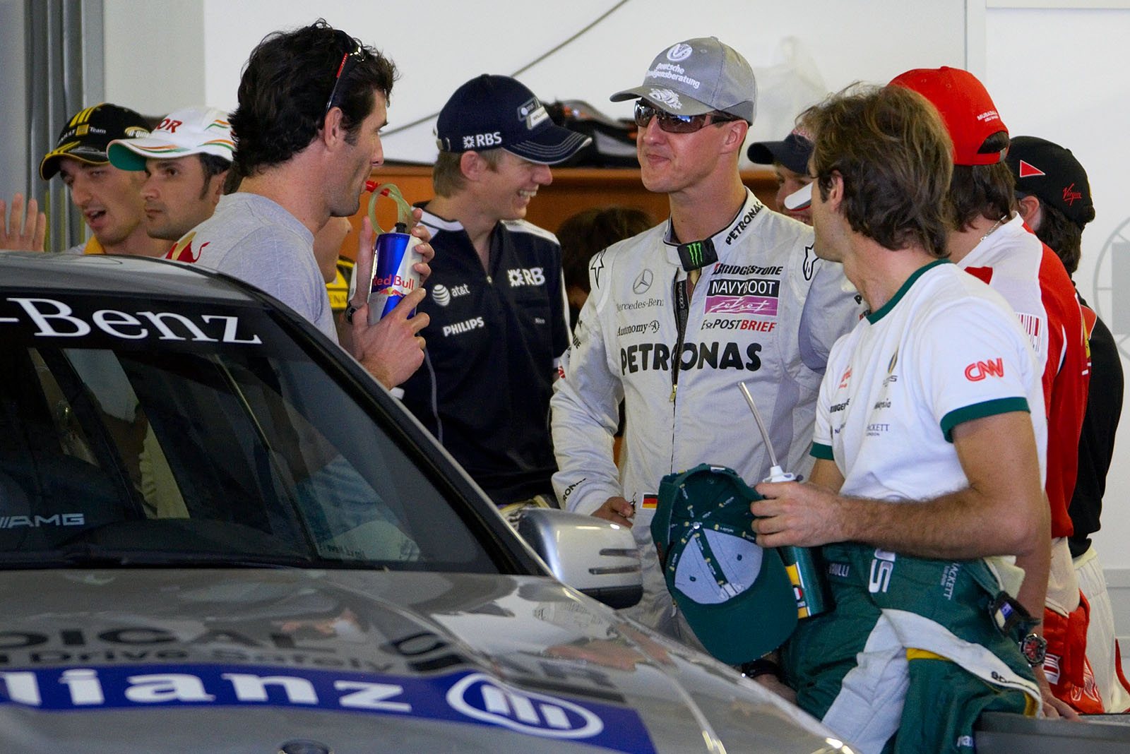 Michael Schumacher chats with other drivers before drivers parade