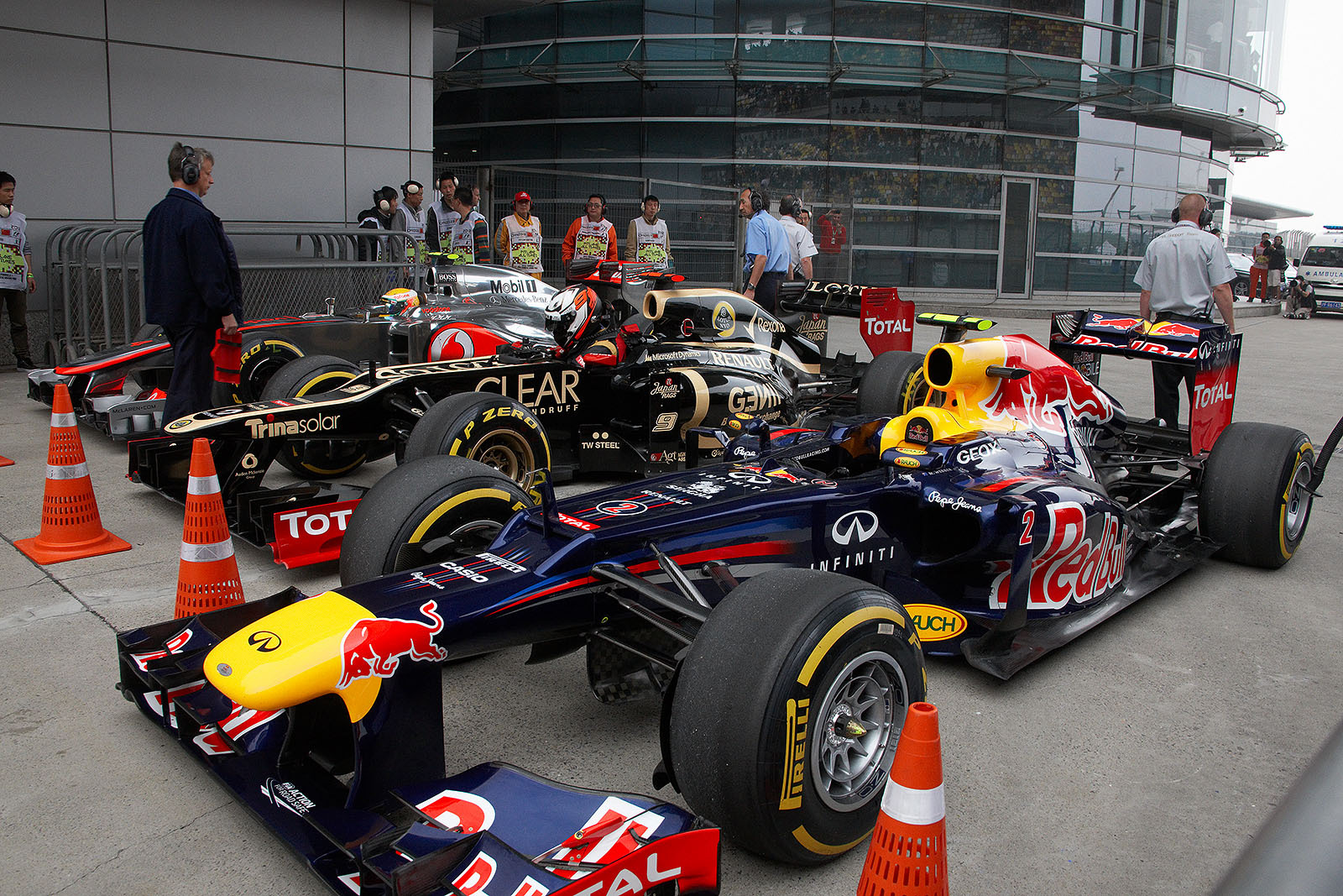After qualification session part 3, Raikkonen and second grid placed Hamilton get out of their cars in parc ferme