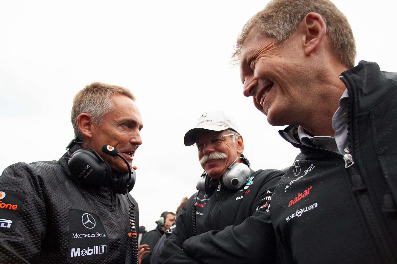 McLaren team principal Martin Whitmarsh chats on the grid with Mercedes chairman of the board Dieter Zetsche