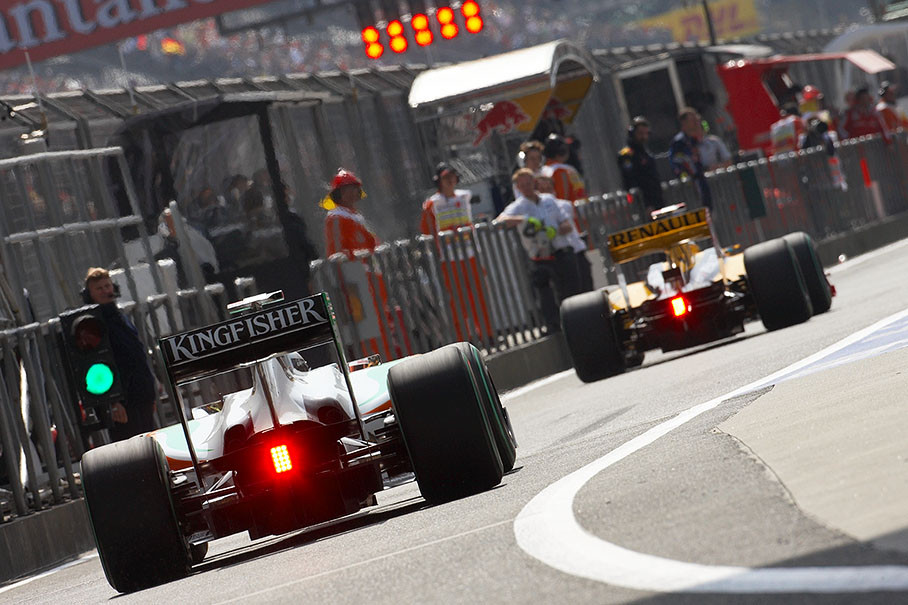 Adrian Sutil, Force India F1 Team, enters pitlane behind Kubica's Renault after qualification session