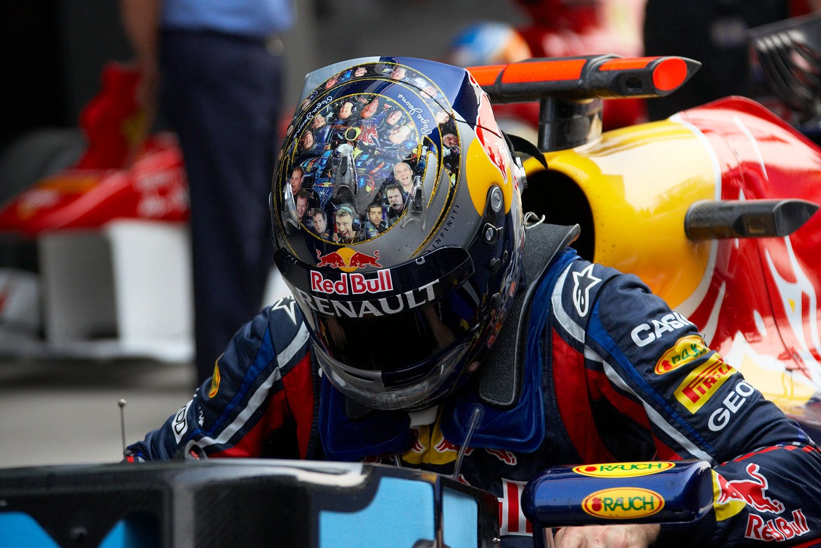 The helmet design of polesitter Sebastian Vettel shows the faces of the Red Bull Racing team