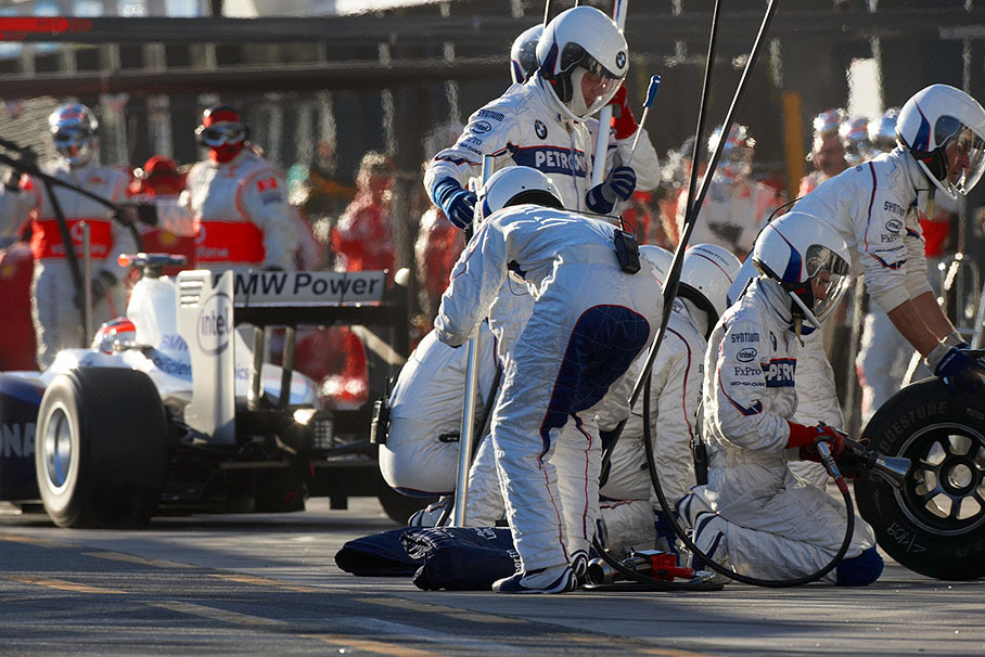 Robert Kubica ejects from a brief service at BMW Sauber F1 pits